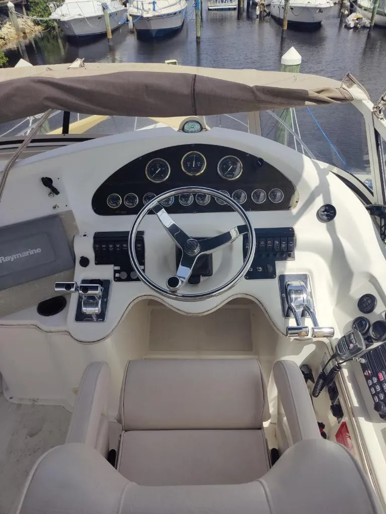 Slide: The Image of 2001 Cruisers Yachts 3750 Motoryacht docked with dinghy. - 28