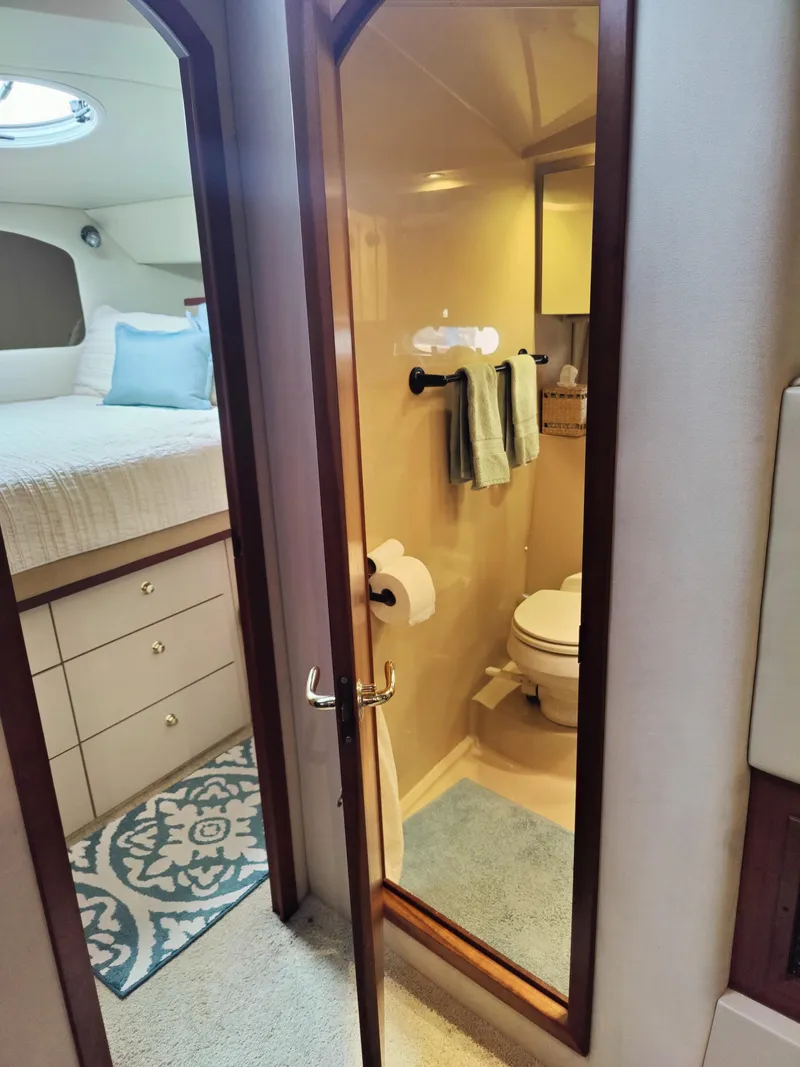Slide: The Image of Bathroom of 2001 Cruisers Yachts 3750 Motoryacht with toilet and mirror. - 8