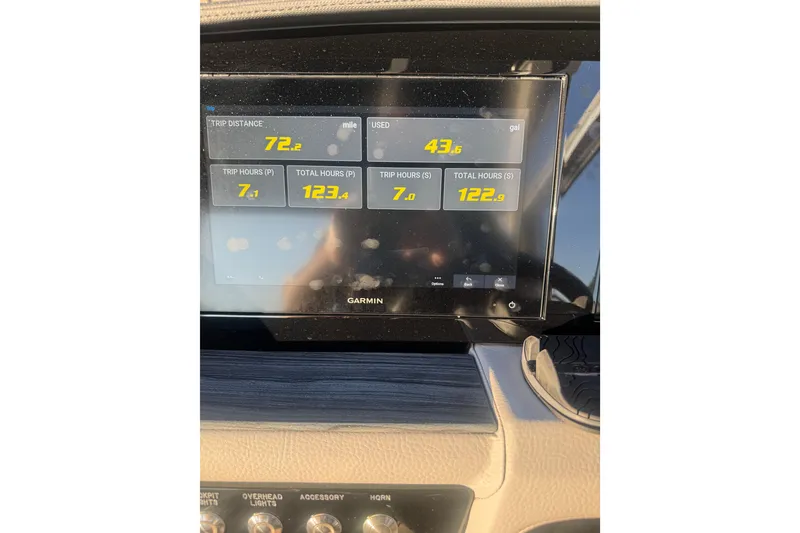 Slide: The Image of Dashboard of 2023 Cobalt 30SC Outboard showing trip data on Garmin display. - 10