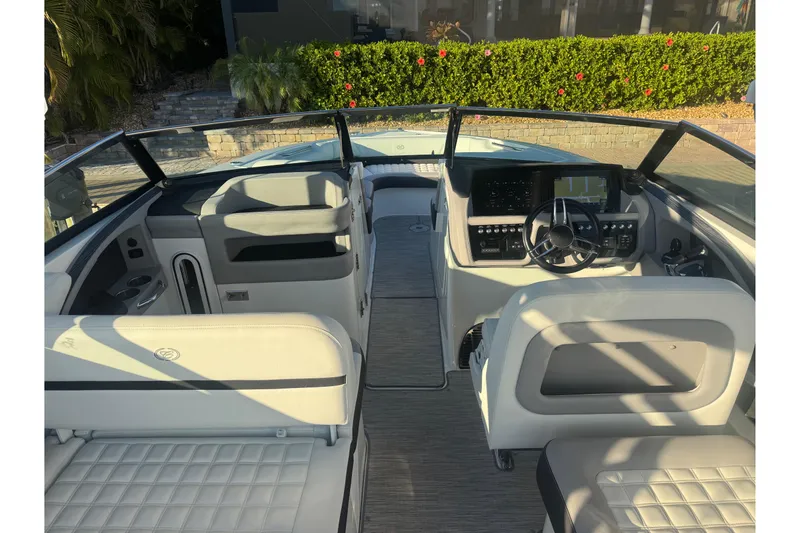 Slide: The Image of 2023 Cobalt 30SC Outboard boat interior with modern dashboard and seating. - 5
