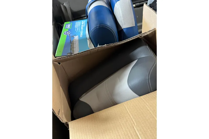 Slide: The Image of Cardboard box with boat seats and a jon boat cover, War Eagle 648LDV 2019 model. - 12