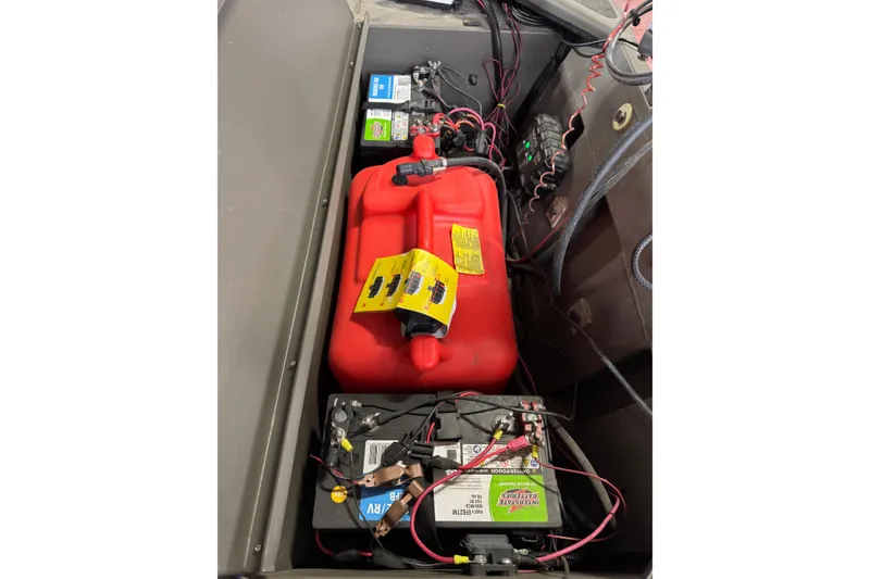 Slide: The Image of 2019 War Eagle 648LDV boat interior with battery and fuel tank setup. - 5