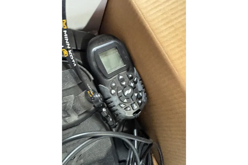 Slide: The Image of Remote control device in a cardboard box, featuring a digital display and multiple buttons. - 8