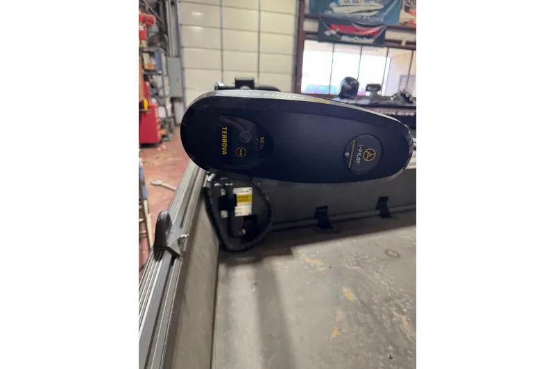 Slide: The Image of 2019 War Eagle 648LDV boat with Minn Kota Terrova trolling motor in a garage setting. - 9