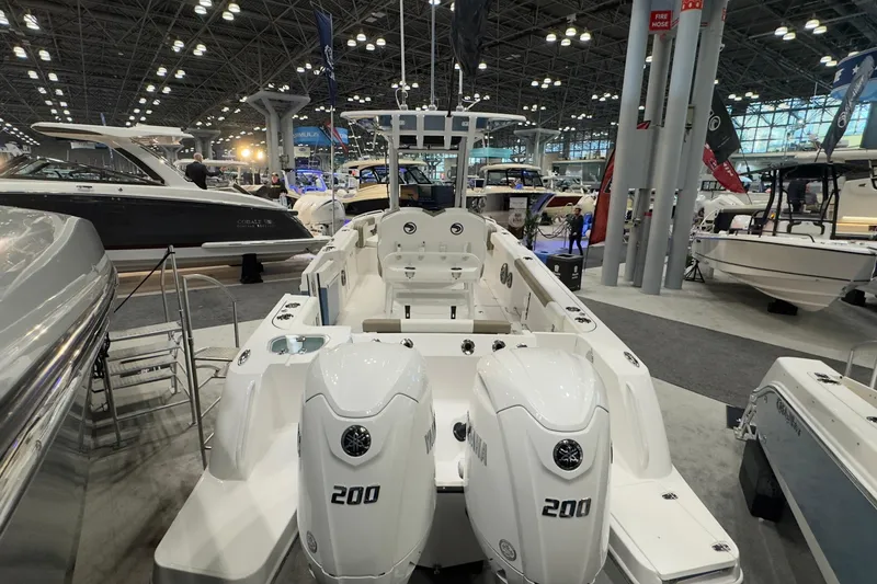 Slide: The Image of Edgewater 250CC 2026 boat displayed at a show. - 4