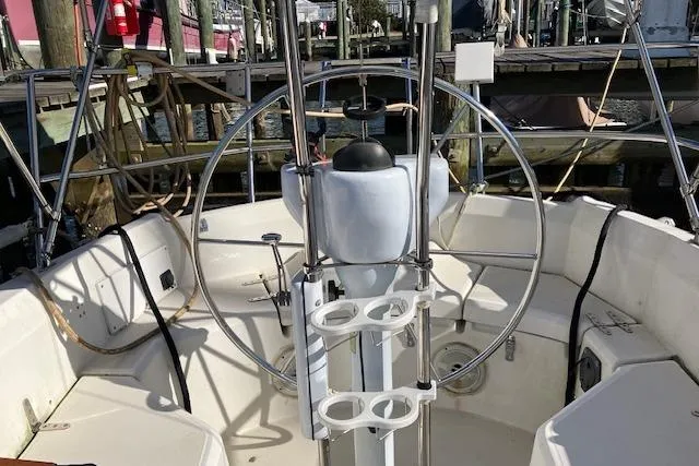 Slide: The Image of Cockpit of 1989 Sabre 30 sailboat with steering wheel and cup holders. - 10