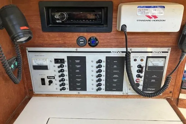 Slide: The Image of Control panel of a 1989 Sabre 30 boat with navigation and communication equipment. - 24
