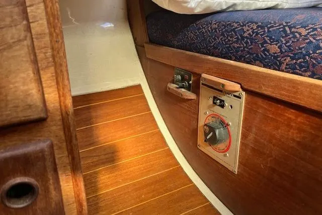 Slide: The Image of Interior of 1989 Sabre 30 sailboat with wooden flooring and control panel. - 29