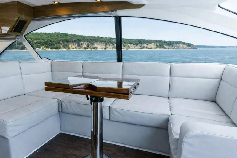 Slide: The Image of Luxurious interior of 2018 Cruisers Yachts 50 Cantius with scenic ocean view. - 13
