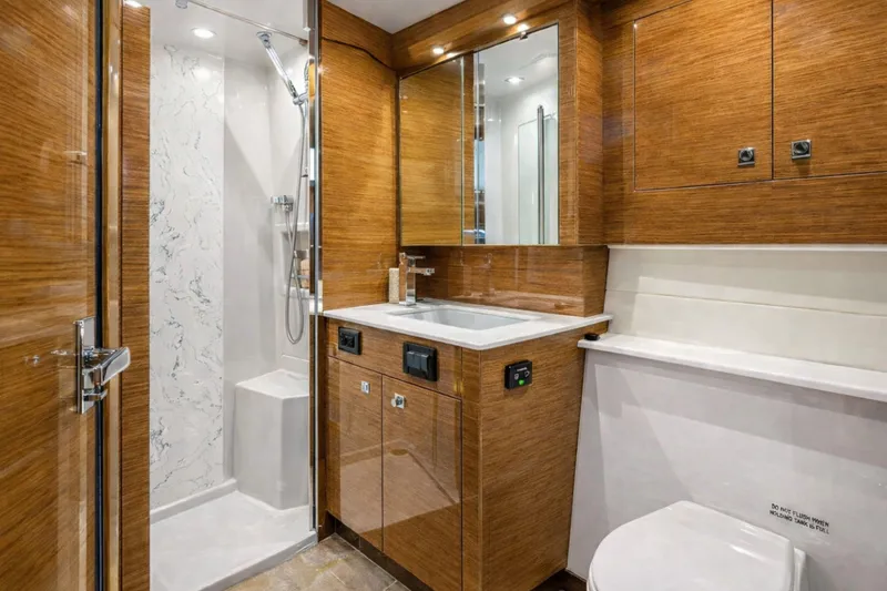 Slide: The Image of Luxurious bathroom in 2018 Cruisers Yachts 50 Cantius with wood finish and modern fixtures. - 22