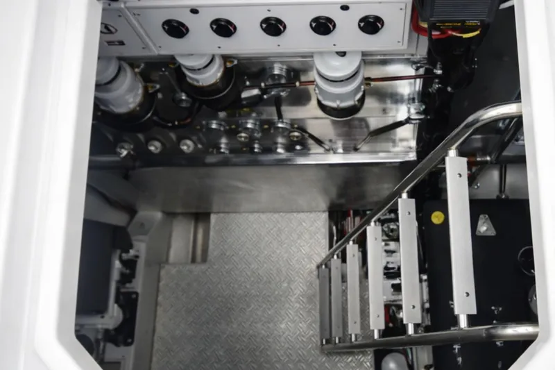 Slide: The Image of Engine room of 2018 Cruisers Yachts 50 Cantius with metal ladder and control panel. - 23