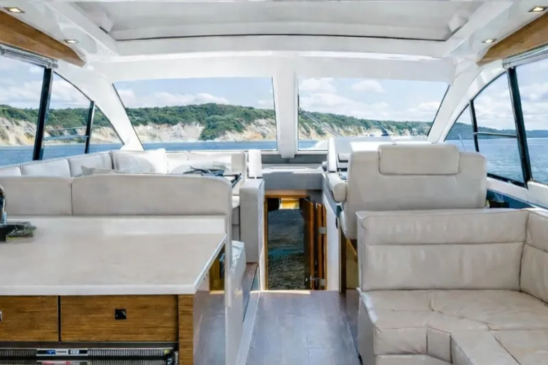 Slide: The Image of Luxurious interior of 2018 Cruisers Yachts 50 Cantius with scenic ocean view. - 10