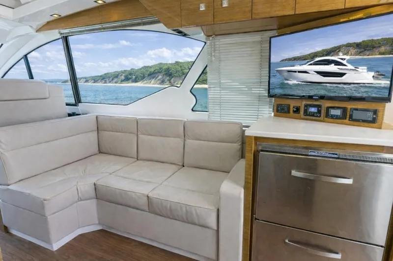 Slide: The Image of Luxurious interior of 2018 Cruisers Yachts 50 Cantius with plush seating and modern amenities. - 11