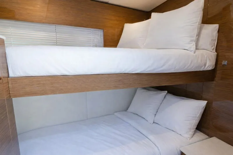 Slide: The Image of 2018 Cruisers Yachts 50 Cantius interior with cozy bunk beds and wooden finish. - 18