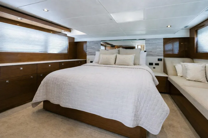 Slide: The Image of Luxurious bedroom interior of 2018 Cruisers Yachts 50 Cantius with elegant bedding and wood accents. - 19