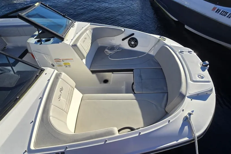 Slide: The Image of 2023 Sea Ray SPX 210 Outboard boat with spacious seating and sleek design. - 14