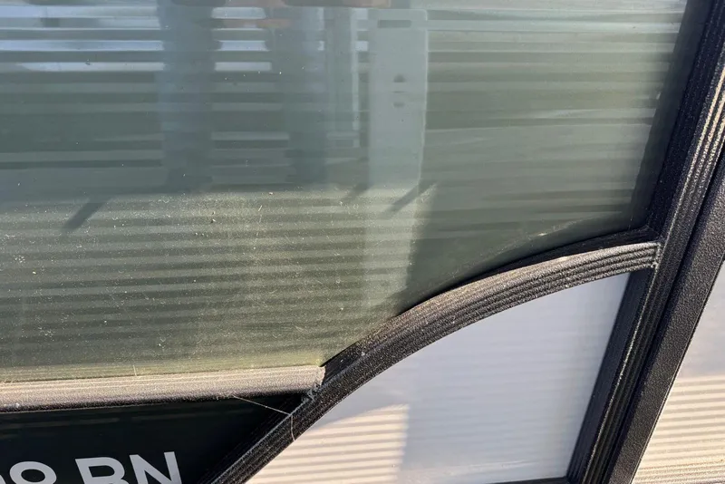 Slide: The Image of Close-up of 2024 Crest Classic LX 220 SLRC boat window detail. - 16