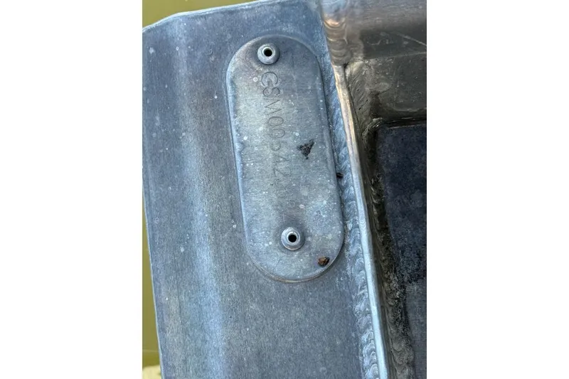 Slide: The Image of Close-up of a metal component on a 2024 Crest Classic LX 220 SLRC boat. - 35