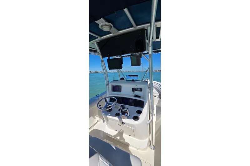 Slide: The Image of Boston Whaler 270 Outrage 2006 boat console with steering wheel and navigation equipment. - 28