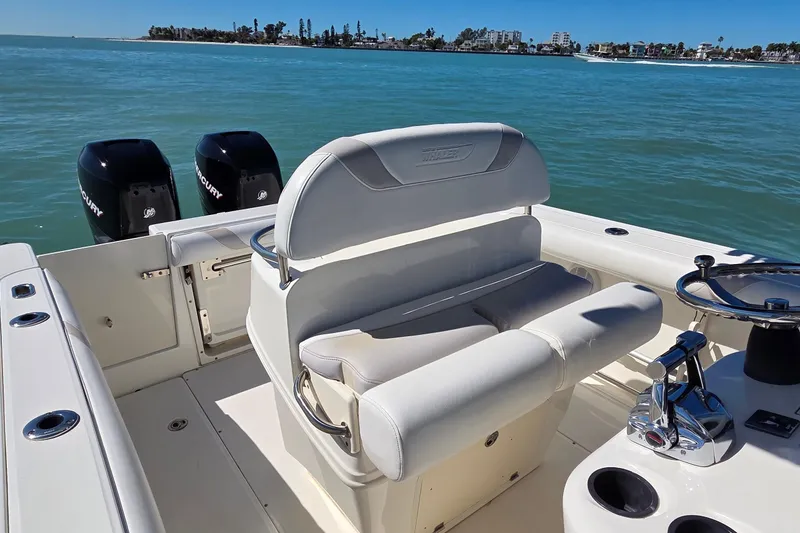 Slide: The Image of 2006 Boston Whaler 270 Outrage boat with dual Mercury engines on calm water. - 34