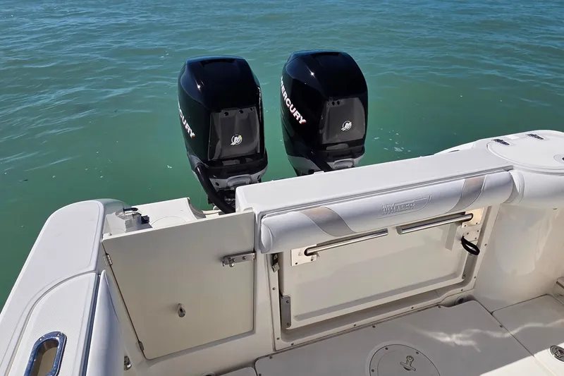 Slide: The Image of 2006 Boston Whaler 270 Outrage with dual Mercury outboard engines on calm water. - 35