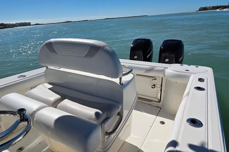 Slide: The Image of 2006 Boston Whaler 270 Outrage boat with dual Mercury engines on open water. - 38