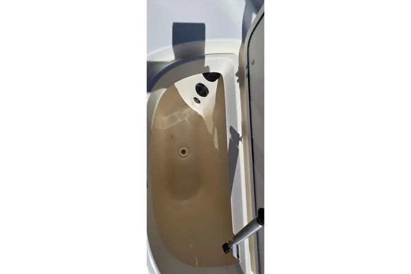 Slide: The Image of 2006 Boston Whaler 270 Outrage livewell interior with clean, smooth finish. - 40
