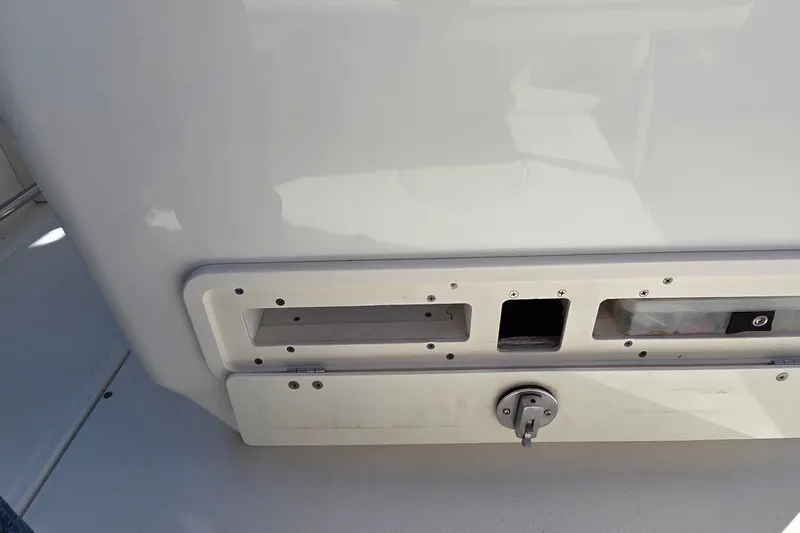 Slide: The Image of 2006 Boston Whaler 270 Outrage boat interior detail with storage compartments. - 42