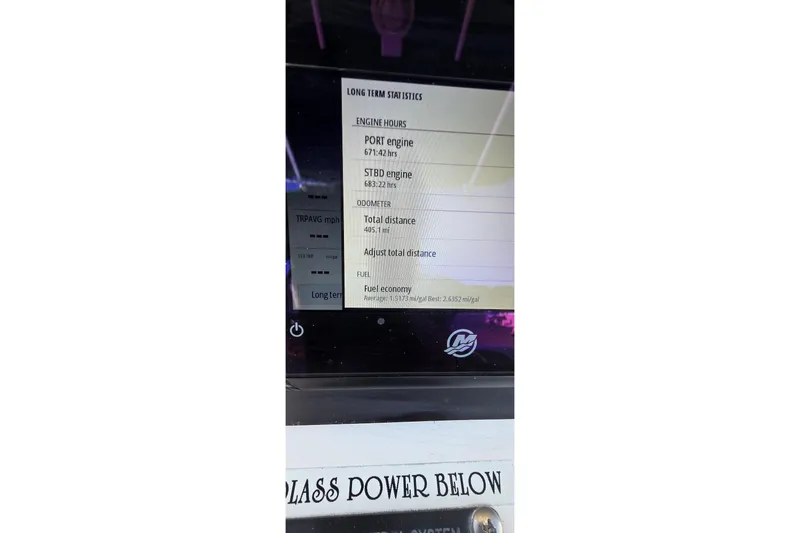 Slide: The Image of Display screen showing engine hours and fuel economy for 2006 Boston Whaler 270 Outrage. - 8