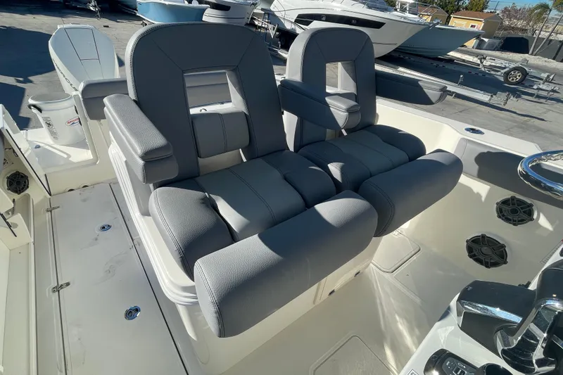 Slide: The Image of 2025 Boston Whaler 280 Outrage boat interior with dual gray captain seats. - 22