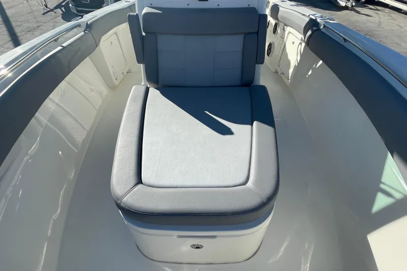 Slide: The Image of 2025 Boston Whaler 280 Outrage boat interior with cushioned seating. - 29