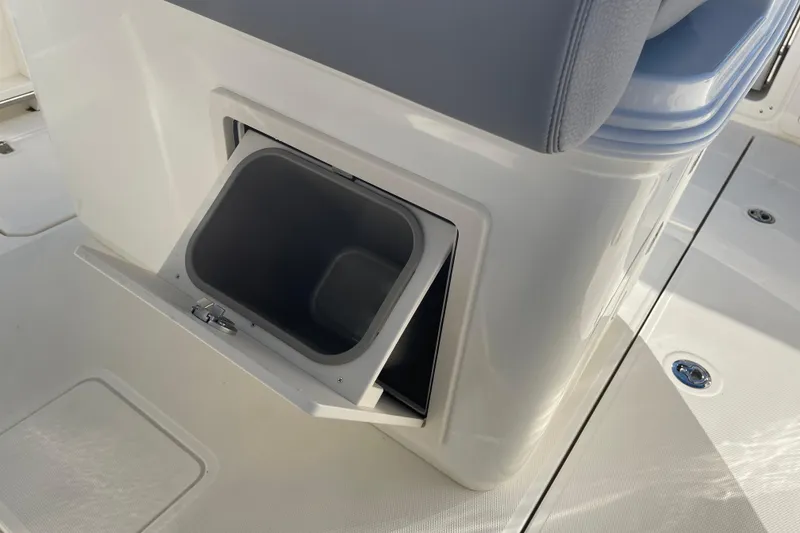 Slide: The Image of Storage compartment on 2025 Boston Whaler 280 Outrage boat, open and empty. - 31