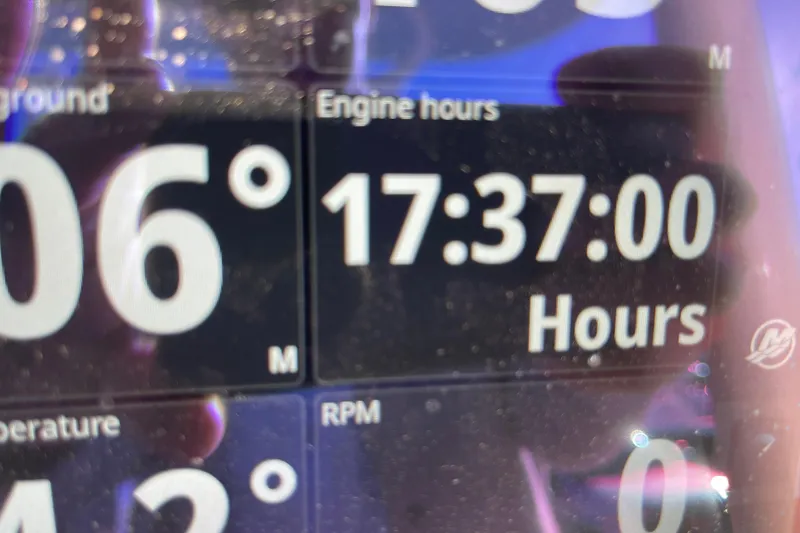 Slide: The Image of Display screen showing 17:37 engine hours on 2025 Boston Whaler 280 Outrage. - 33