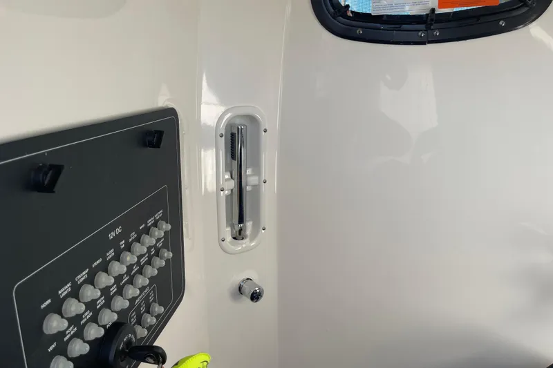 Slide: The Image of Control panel and interior details of 2025 Boston Whaler 280 Outrage boat. - 34