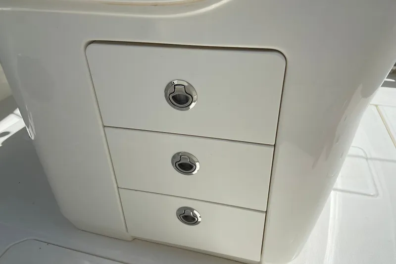 Slide: The Image of 2025 Boston Whaler 280 Outrage boat storage drawers with sleek handles. - 43