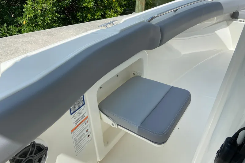 Slide: The Image of 2025 Boston Whaler 280 Outrage interior with cushioned seating and sleek design. - 46