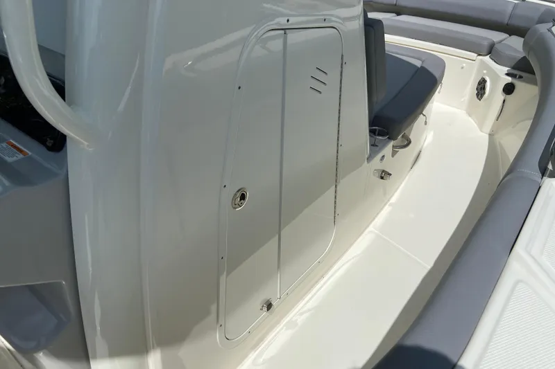 Slide: The Image of 2025 Boston Whaler 280 Outrage interior with seating and storage compartment. - 59