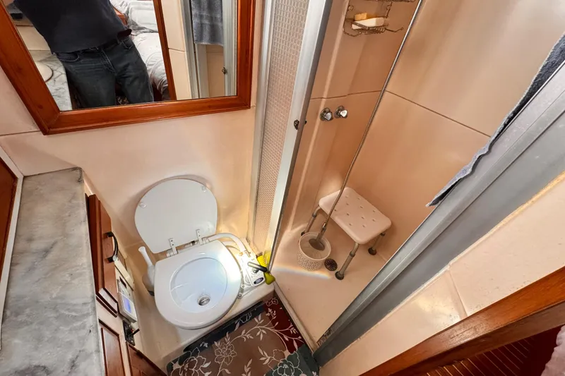 Slide: The Image of Compact bathroom in 1983 Sea Ranger 45 Sun Deck yacht with shower and toilet. - 15