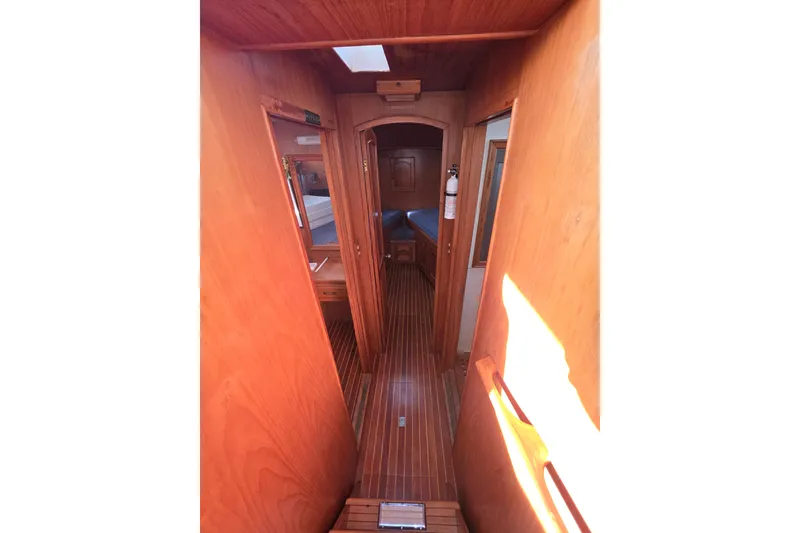 Slide: The Image of Interior view of 1983 Sea Ranger 45 Sun Deck yacht with wooden finish. - 16