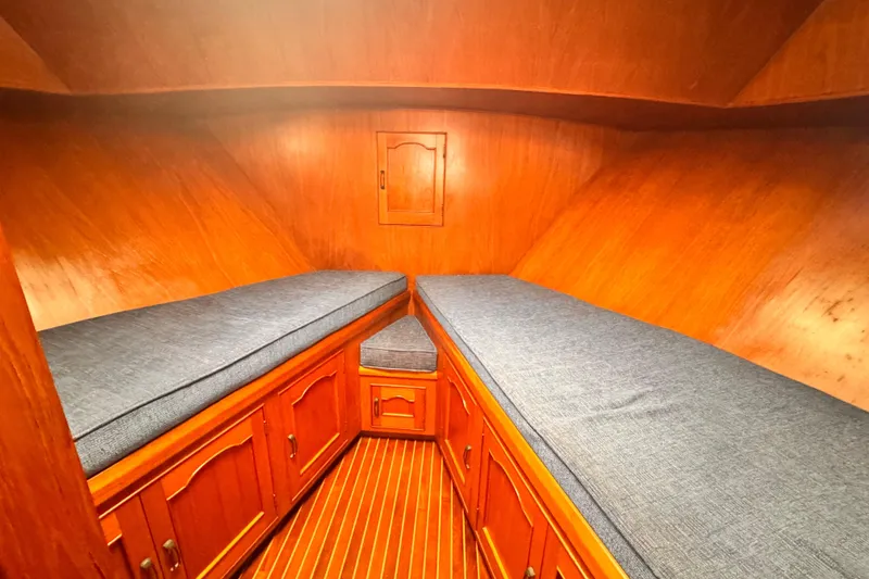 Slide: The Image of 1983 Sea Ranger 45 Sun Deck cabin with wooden interior and twin beds. - 19