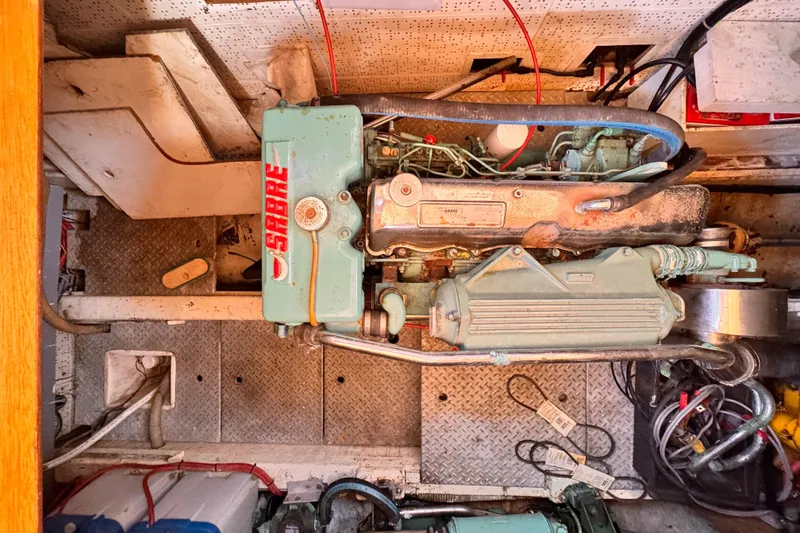 Slide: The Image of Engine room of 1983 Sea Ranger 45 Sun Deck with Sabre engine components. - 24