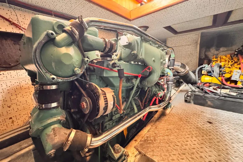 Slide: The Image of Engine room of 1983 Sea Ranger 45 Sun Deck yacht, showcasing detailed machinery. - 26