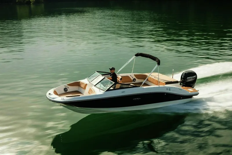 The Image of 2023 Sea Ray SPX 210 Outboard cruising on a serene lake. - 0