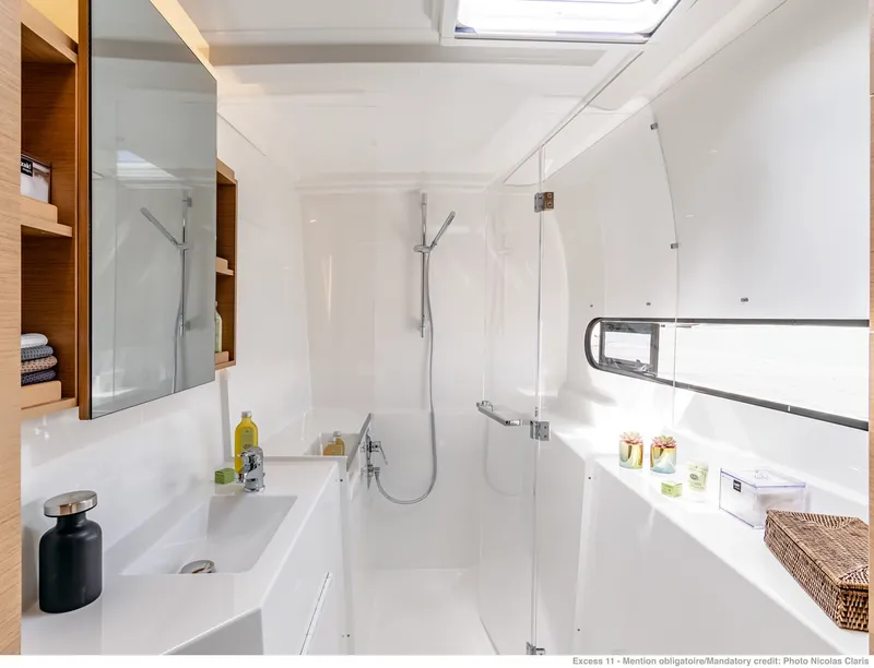 Slide: The Image of Modern bathroom in Excess 11 catamaran, model year 2026. - 10