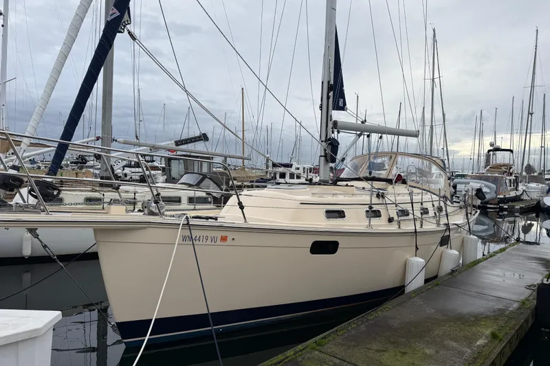 The Image of 2025 Island Packet 349 sailboat docked at marina on a cloudy day. - 0