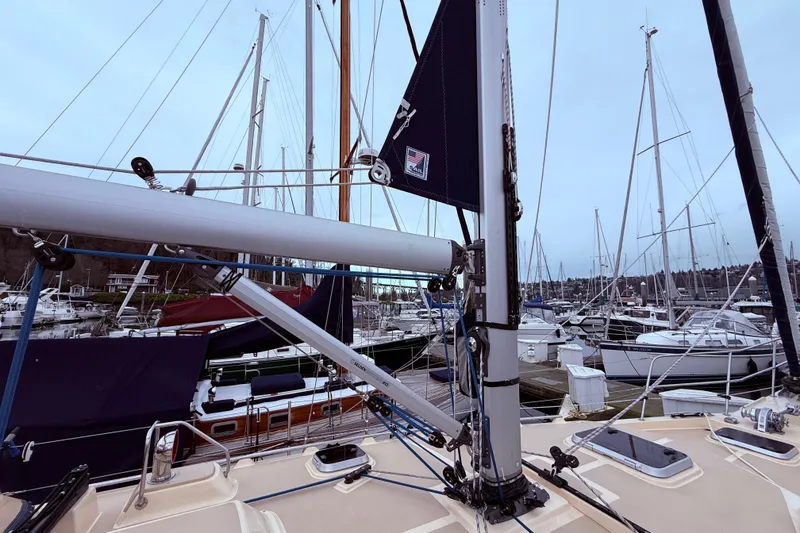 Slide: The Image of 2025 Island Packet 349 sailboat docked in a marina, surrounded by other boats. - 10