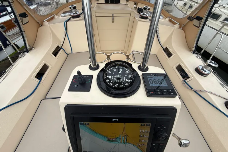 Slide: The Image of Cockpit of 2025 Island Packet 349 sailboat with navigation instruments and compass. - 18
