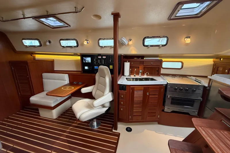 Slide: The Image of Luxurious 2025 Island Packet 349 yacht interior with modern kitchen and seating area. - 24