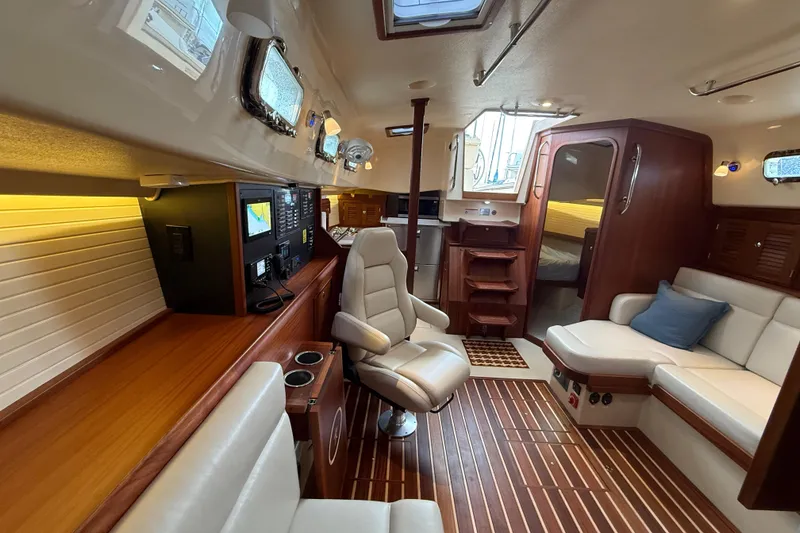Slide: The Image of Luxurious interior of 2025 Island Packet 349 yacht with modern navigation equipment and comfortable seating. - 26