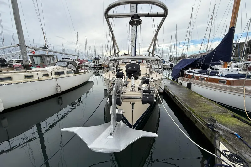 Slide: The Image of 2025 Island Packet 349 sailboat docked in a marina, surrounded by other boats. - 3